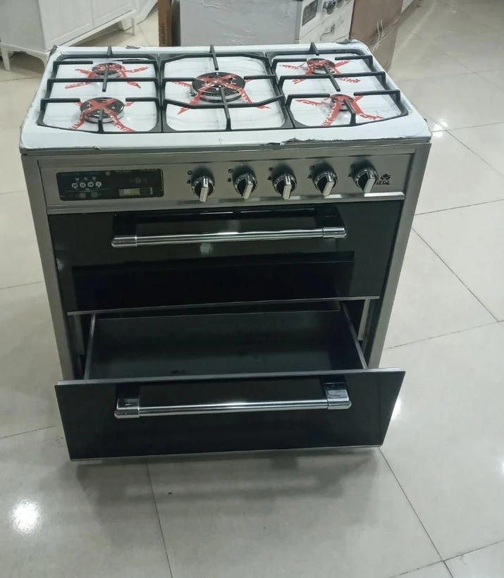 اجاق-گاز-۵شعله-طرح-فر-صفحه-استیل-نوماهان.webp اجاق گاز ۵ شعله طرح فر صفحه استیل نو ماهان - Image 1